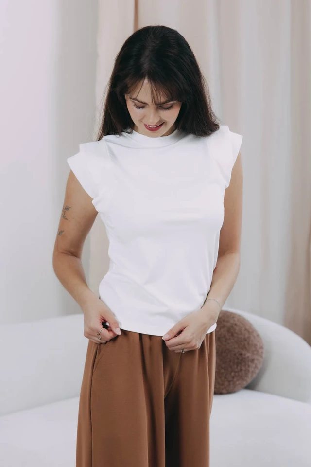 Káťa má na sebe pri svojej výške 170 cm veľkosť XS.